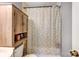 Compact bathroom features a vanity sink, toilet, and a cabinet with a shower curtain at 1001 E 8Th Ave, Gastonia, NC 28054