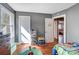 Bedroom featuring a window, hardwood floors, and a play table at 1001 E 8Th Ave, Gastonia, NC 28054