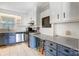 Functional kitchen featuring white cabinets, stainless steel appliances, and a convenient breakfast bar at 1001 E 8Th Ave, Gastonia, NC 28054