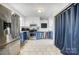 Charming kitchen featuring stainless steel appliances, blue and white cabinets, and stylish tile flooring at 1001 E 8Th Ave, Gastonia, NC 28054