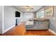Bright living room with hardwood floors, ceiling fan, and lots of space to design as you wish at 1001 E 8Th Ave, Gastonia, NC 28054