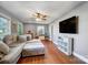 Spacious living room with hardwood floors, a ceiling fan, and plenty of space for entertaining at 1001 E 8Th Ave, Gastonia, NC 28054