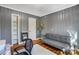 Cozy home office features painted gray paneled walls and hardwood floors at 1001 E 8Th Ave, Gastonia, NC 28054