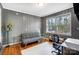 Office showcasing a sofa, desk and chair, printer, and window with natural light at 1001 E 8Th Ave, Gastonia, NC 28054
