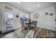 Cozy dining area featuring a wooden table with seating for four and natural light from windows at 109 Watrous Way, Mooresville, NC 28115