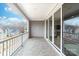 This balcony has a concrete floor and white railing. The sliding glass doors provide easy access to the indoors at 110 Wesser St, Davidson, NC 28036