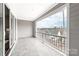 This outdoor balcony offers an excellent view of the surrounding neighborhood and great natural light at 110 Wesser St, Davidson, NC 28036