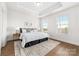 Bright bedroom with tray ceiling, carpeted floors, and two large windows for plenty of natural light at 110 Wesser St, Davidson, NC 28036