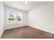 Bedroom featuring hardwood floors and a large window, providing abundant natural light at 110 Wesser St, Davidson, NC 28036