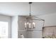Stylish, open frame chandelier fixture in a new home adds sophisticated charm to this bright living space at 110 Wesser St, Davidson, NC 28036