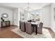 Elegant dining room with modern chandelier and large windows providing plenty of natural light at 110 Wesser St, Davidson, NC 28036