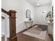 Bright foyer with hardwood floors, accent furniture and decor, with stairs to the left at 110 Wesser St, Davidson, NC 28036