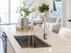 Modern kitchen sink with sleek faucet and white countertop presents a clean and contemporary look at 110 Wesser St, Davidson, NC 28036