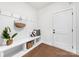 Well-organized mudroom featuring built-in bench seating, storage shelves, and coat hooks for added convenience at 110 Wesser St, Davidson, NC 28036