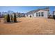 Spacious backyard featuring a well-maintained lawn and privacy fence, perfect for outdoor activities at 11031 Larkslea Ln, Charlotte, NC 28278