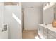 Bright bathroom with a glass-enclosed shower, linen closet, and modern fixtures at 11031 Larkslea Ln, Charlotte, NC 28278