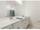 Bright bathroom with double vanity, a large mirror, and modern finishes at 11031 Larkslea Ln, Charlotte, NC 28278