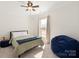 Comfortable bedroom with a cozy beanbag and soft natural light at 11031 Larkslea Ln, Charlotte, NC 28278