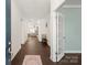 Inviting foyer with hardwood floors leads to a spacious living area at 11031 Larkslea Ln, Charlotte, NC 28278