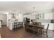 Modern kitchen with white cabinets, stainless steel appliances, and a center island with seating at 11031 Larkslea Ln, Charlotte, NC 28278