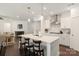 Bright kitchen features stainless steel appliances, an island, and dark wood floors at 11031 Larkslea Ln, Charlotte, NC 28278
