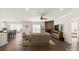 Bright living room features hardwood floors, a stone fireplace, and a ceiling fan at 11031 Larkslea Ln, Charlotte, NC 28278