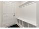 Functional mudroom with built-in bench, cubbies, and coat hooks at 11031 Larkslea Ln, Charlotte, NC 28278