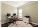 Office space with neutral walls, natural light, and built-in desk with storage at 11031 Larkslea Ln, Charlotte, NC 28278