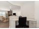 Open office space with built-in desk, overlooking the living room with a fireplace at 11031 Larkslea Ln, Charlotte, NC 28278