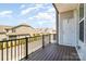 Townhome deck overlooking the community with wood floors and black metal railings at 11537 Red Rust Ln, Charlotte, NC 28277
