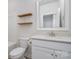 Bathroom features a white vanity, quartz countertop, modern fixtures, and a stylish mirror at 11537 Red Rust Ln, Charlotte, NC 28277