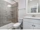 Updated bathroom featuring a tiled walk-in shower, vanity, and modern fixtures at 11537 Red Rust Ln, Charlotte, NC 28277
