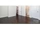 Hardwood flooring in bedroom with stairs and bathroom located nearby at 11537 Red Rust Ln, Charlotte, NC 28277
