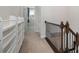 Hallway features carpet flooring, a wooden railing, and built-in shelving perfect for books at 11537 Red Rust Ln, Charlotte, NC 28277