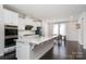 Bright and modern kitchen featuring an island, stainless appliances, and white cabinetry at 11537 Red Rust Ln, Charlotte, NC 28277