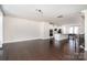 Bright living area with hardwood flooring, open to the kitchen, and filled with natural light at 11537 Red Rust Ln, Charlotte, NC 28277