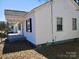 Charming white home with a covered porch and black shutters on the windows at 116 Nella St, Chester, SC 29706