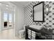 Modern bathroom with decorative patterned tile, a sleek vanity, and a view of the pool and lake at 124 Wellcraft Ct, Mooresville, NC 28117