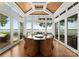 Sun-filled dining room with water views, wood ceiling, and access to the pool at 124 Wellcraft Ct, Mooresville, NC 28117
