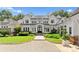 Stunning lakefront home showcasing well-kept lawn, meticulous landscaping and architectural excellence at 124 Wellcraft Ct, Mooresville, NC 28117