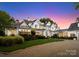 Beautiful home boasting a well-maintained lawn, mature trees, and classic architectural details at 124 Wellcraft Ct, Mooresville, NC 28117