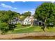 Lakeside home with expansive lawn, mature trees, and a beautiful view of the water at 124 Wellcraft Ct, Mooresville, NC 28117