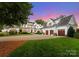 Elegant home with multiple garage bays, meticulous landscaping, and a grand circular driveway at 124 Wellcraft Ct, Mooresville, NC 28117