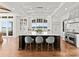 Gourmet kitchen with a large island, modern appliances, and lake views at 124 Wellcraft Ct, Mooresville, NC 28117