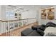 Living room with custom ceiling, built-in shelving, and a view of the outdoor pool at 124 Wellcraft Ct, Mooresville, NC 28117