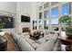 Comfortable living room with a fireplace, large windows, and scenic lake view at 124 Wellcraft Ct, Mooresville, NC 28117