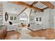 Spacious main bedroom with vaulted ceiling, exposed beams, comfortable seating, and ample natural light at 124 Wellcraft Ct, Mooresville, NC 28117