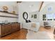 Inviting main bedroom with custom wet bar, beamed ceiling, natural light and comfortable chair at 124 Wellcraft Ct, Mooresville, NC 28117