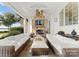 Inviting covered patio with stone fireplace, comfortable seating, and an open, airy design at 124 Wellcraft Ct, Mooresville, NC 28117