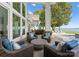 Stylish outdoor patio featuring comfortable seating, stunning lake views, and an open layout at 124 Wellcraft Ct, Mooresville, NC 28117